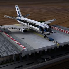 a lego model of an airplane sitting on top of a runway