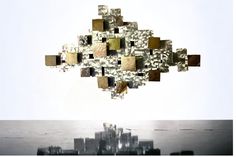 an abstract piece of art is floating in the air over a cityscape with skyscrapers