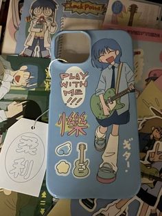 a cell phone case sitting on top of a pile of stickers