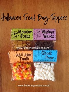 halloween treat bag toppers with candy and candies in them on a wooden table