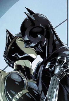 batman and catwoman kissing each other in front of a window