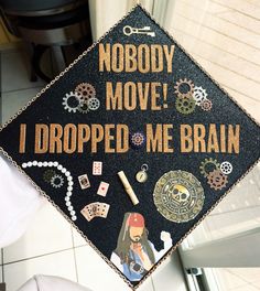 a decorated graduation cap that says nobody move i dropped me brain