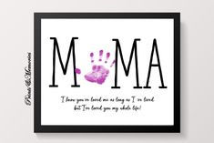 a framed print with the words mom and handprints on it, in black frame