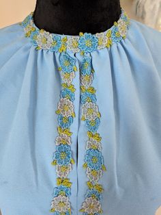 pretty blue dress with embroidery and keyhole at neck. zip up back. Measurements flat in inches: 38.5 long 21 pit to pit 16 shoulder to shoulder  18.5 waist  7 sleeve Blue Long Sleeve Dress With Embroidered Neckline, Long Sleeve Blue Dress With Embroidered Neckline, Blue Embroidered Dress With Neckline Detail For Spring, Blue Embroidered Dress For Spring, Pretty Blue Dress, Dress With Embroidery, Blue Shift Dress, Dress Clothes For Women, Blue Dress