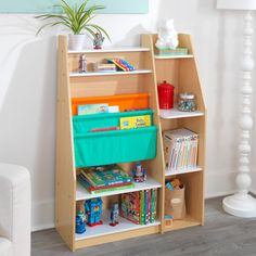 a book shelf with books and toys on it