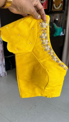 Product Descriptions : Yellow silk patterned & intricate pearl detailed hand worked blouse having highlighted pearl hand works for neck both front & back as shown Note : saree is not included with this product View this post on Instagram A post shared by Handcrafted Sarees by Shobana Nithin (@threadslabel_india) View this post on Instagram A post shared by Handcrafted Sarees by Shobana Nithin (@threadslabel_india) Blouse Neck Maggam Work Designs, Stripes Saree Blouse Designs, Back Blouse Work Designs, Orange Silk Blouse Designs, Blouse Designs With Pearls, Pearl Work On Blouse, Blouse With Work Designs, Plain Golden Blouse Designs, Pearls Maggam Work Designs