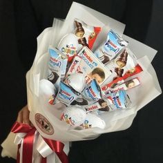 a bouquet of candy wrapped in white paper