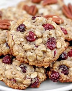 cookies with cranberries and pecans on a white plate