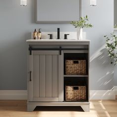 a bathroom vanity with two baskets under the sink and a mirror above it, in front of a blue wall