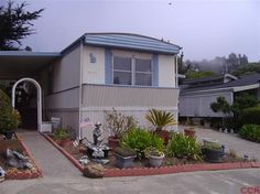 a house that has some plants in front of it