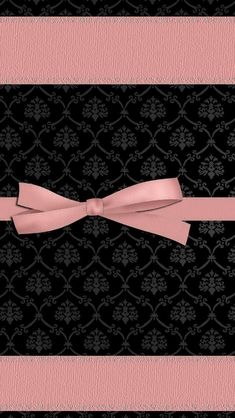 a black and pink wallpaper with a bow on it