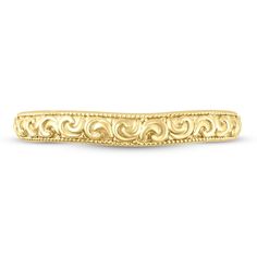 Stylish curlicues of 14K yellow gold are trimmed with delicate milgrain detail in this timeless women's wedding band. Luxury 14k Gold Wedding Band With Decorative Details, Heirloom Gold Filigree Ring With Decorative Band, Luxury Yellow Gold Milgrain Rings, Luxury Yellow Gold Rings With Milgrain, Luxury Yellow Gold Rings With Milgrain Detail, Ornate Yellow Gold Jewelry With Decorative Band, Classic Yellow Gold Jewelry For Ceremonial Wedding, Elegant Yellow Gold Jewelry With Decorative Band, Engraved Yellow Gold Filigree Wedding Ring