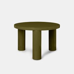 a small round table with two legs and a green plastic top on an isolated white background