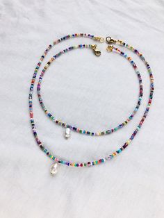 Mother-daughter beaded rainbow necklace set with pearl pendant is handmade from the best materials. You can buy it as a gift for a friend, sister, girlfriend. THIS IS LISTING IS FOR 2 NECKLACES. MEASUREMENTS: Choose a length for your choker necklaces (measured in inches). Measure the length of your neck with a measuring tape or you can use any thread, rope, or cable for telephone and after apply the measurements to a regular ruler. If you have any questions about your size be free to text me a m White Necklaces With Colorful Beads For Friendship, Bohemian Necklace With Tiny Beads For Friendship, Bohemian Tiny Beads Necklace For Friendship, Handmade Heishi Beads Necklace As Gift, Heishi Bead Necklace With Heart Beads Gift, Gift Necklace With Heart Heishi Beads, Jewelry 2024, Bracelet Business, Beaded Rainbow