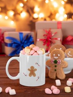 a mug filled with marshmallows and gingerbread cookies