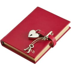 a red book with a heart shaped key attached to the front and side of it