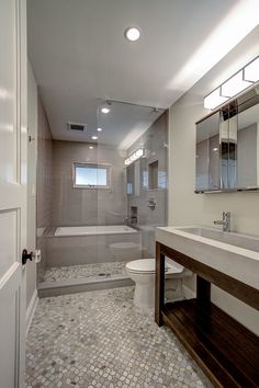 a bathroom with a sink, toilet and bathtub