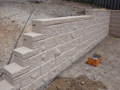 a cinder block wall being built with concrete blocks