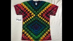 a tie dye shirt with the word med on it in front of a white background