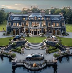 a large mansion with cars parked in front of it