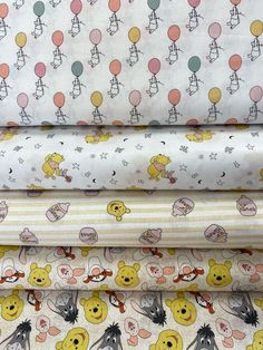 winnie the pooh fabric collection in various sizes and colors, including white, yellow, pink