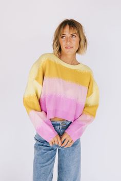 Don't make any commitments in the stylish No Promises Sweater. This crop fit, long sleeve top is sure to turn heads with its eye-catching orange and pink ombre. You'll never be tied down to just one look! Details Knit material Crop fit Drop shoulder Long sleeve Round neckline Sizing Approximate measurements: SIZE LENGTH BUST Small 18.5” 50” Medium 19” 53” Large 20” 54” Fabric has stretch Model is 5’8” wearing small Material 98% Acrylic 2% Nylon Hand wash in cold water with similar colorsNo soaki Pink Crew Neck Crop Top For Fall, Fall Pink Crew Neck Crop Top, Pink Cropped Crop Top For Fall, Pink Cropped Sweater For Spring, Casual Pink Cropped Sweater, Trendy Gradient Color Tops For Spring, Pink Crew Neck Cropped Sweater For Spring, Trendy Yellow Long Sleeve Crop Top, Trendy Multicolor Cropped Sweater For Spring