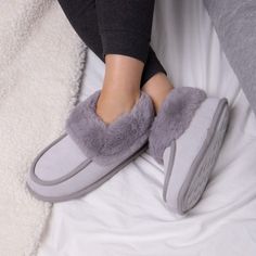 * Made from genuine real suede
* Pillowstep tufted insole for added comfort
* Warm and cosy for memory foam lining
* Lightweight durable sole
* Effortless heel to toe motion
* Slip resistance
* Water repellent outer layer
Made from genuine real suede, these slipper boots are perfect for keeping your feet cosy while you complete your daily chores. The fur trim sits right around your ankles and the suede has a water repellent outer layer to protect them from spillages. The unique pillowstep insole combined with the warm and cosy memory foam lining makes these slippers super comfortable to wear. The durable sole allows for an effortless heel to toe motion and has improved slip resistance, great for indoor and outdoor use. Bootie Slippers, Daily Chores, Suede Moccasins, Fur Lined Boots, Lady Grey, Gray Suede, Slipper Boots, Suede Shoes, Vans Classic Slip On Sneaker