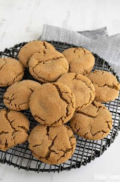 a plate full of cookies sitting on top of a table next to a towel and napkin