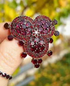 Beautiful hand made brooch that later was turned into one of a kind pendant!  please note- for sale  just 1 item  Bohemian - 1900  Metall -  Tompak gold plated  Stones - Natural Bohemian garnets - Pyrope  from Czechoslovakia  Size -   4 x 4.4    -  cm            -  1.57  x   1.73   inches  Good  vintage condition. Don't forget visit my collection https://myoldvintage.etsy.com            or Visit Instagram my name is - MyOldVintage - If you have any further questions or you need some help with something, please get in touch with us. We will be happy to help you. The other jewels on the last page you can find in my other auction. Please feel free to browse my other items and be sure to follow me on Instagram myoldvintage , to see videos of my collection. If you have any questions or concerns Bohemian Garnet Jewelry, Ornate Garnet Filigree Jewelry, Antique Red Brooch Jewelry, Intricate Jewelry, Ornate Silver Garnet Jewelry, Handmade Vintage Red Brooches, Vintage Silver Earrings, Pyrope Garnet, Natural Bohemian