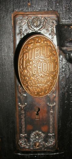 an old fashioned public school door knob