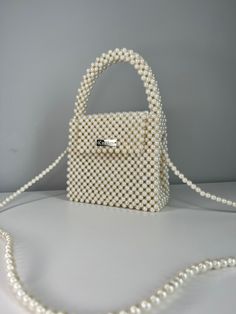 Crystal bead bag, Bead shoulder bag, Women Bead bag, Bead Bag, Perl Bead bag, Perl Crystal Bead Bag, perl Crystal Bead bag, Women handbags, Bead Bag Vintage Dimensions - Width:  (25,5 cm.) - Height:  (16 cm.) - Depth:  (6cm.) Bags are 100% handmade.This size making it perfect to hold your keys, cards, money and smartphones. I hope you collect great memories with this bag. SHIPPING (time 14-20 days) also you can choose EXPRESS shipping (7-14 days) SHIPPING - This clutch is made and ready to ship Beaded Cream Shoulder Bag For Gift, Pearl White Beaded Wedding Bags, Pearl Beaded Evening Bag, Pearl Beaded Bags For Events, Wedding Pearl Beaded Bags, Beaded Pearl Evening Bag, Kiev Ukraine, Bride Bag, Wedding Dress Hanger