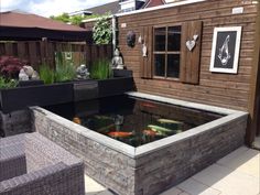 a fish pond in the middle of a patio