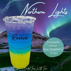 a blue raspberry and lemonade drink with northern lights in the background