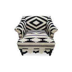 an upholstered chair with black and white patterned fabric