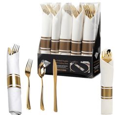 the gold and white napkins are set next to each other with forks, knives and spoons