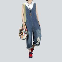 Introducing our new 2023 Autumn Collection with the ultimate city vibe statement piece ââ‚?the Fox Embroidery Women's Denim Jumpsuit! Crafted with premium denim and baggy fit. this timeless piece is sure to keep all eyes on you.Why They're Your Next Wardrobe EssentialFeaturing a unique fox embroidery pattern and a distressed wash. this jumpsuit is the very definition of street style. The comfortable baggy fit and the resilient zipper and button duo give you a perfect balance of style and conveni Denim Blue Jumpsuits For Spring, Spring Denim Blue Wide Leg Jumpsuits And Rompers, Spring Cotton Denim Jumpsuit In Dark Wash, Cotton Wide Leg Denim Jumpsuit, Spring Dark Wash Cotton Denim Jumpsuit, Wide Leg Denim Blue Jumpsuits And Rompers For Spring, Denim Blue Wide Leg Jumpsuits For Spring, Spring Denim Jumpsuit, Denim Blue Overall Jumpsuit For Spring