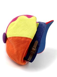 Colorful newsboy style linen and cotton cap. Inspired by the early 20th century newspaper delivery boys. It has a large visor to protect from the sun. It can be used all year. The length of the visor is 6 centimeters. The interior is made of a very light cotton lining The back of the cap has a small eco-leather belt to adjust the measurement up to three centimeters less. Cut and sewn on the bias, this cap adapts very well to the head due to its original pattern. For its production we use top qua Casual Multicolor Brimmed Hat, Casual Adjustable Rainbow Hat, Casual Multicolor Hat With Short Brim, Playful Multicolor Cotton Hats, Casual Multicolor Short Brim Hat, Playful Multicolor Short Brim Hat, Adjustable Multicolor Baseball Cap For Spring, Multicolor Curved Brim Baseball Cap For Summer, Fun Multicolor Baseball Cap For Spring