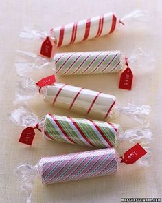 four candy canes wrapped in plastic wrappers