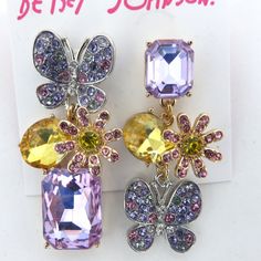 New Mismatched Drop Earrings Featuring Butterfly, Daisies And Colorful Mixed-Cut Stone Gems. Charms Adorned With Delicate Stone Accents. Post Back Closure Set In Polished Two-Tone Zinc And Glass Metal Approx. Drop: 1 1/2” Questions? Leave A Comment Below! Trendy Lavender Jewelry For Party, Black Velvet Bow, Betsey Johnson Earrings, Owl Earrings, Mismatched Earrings, Sparkly Earrings, Holiday Earring, Betsey Johnson Jewelry, Skull Earrings