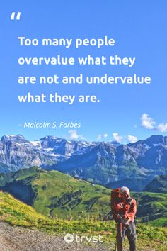 two people standing on top of a hill with mountains in the background and a quote from malcolm s forrest that reads, too many people overvalue what they are not