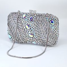 New to our Millennium collection, This beautiful romantic bridal clutch bag is made of very fine quality of rhinestones and metal and it comes with two chains, one chains length is 15 inches for a shoulder bag 45 inches long cross body bag Detachable chain for your Big day! Dimensions- Depth of the bag is 2 inches, length oh the bag is 7.5 inches and width of the bag is 5 inches.   ► ABOUT YOUR ORDER * All items are neatly packaged in our beautiful jewelry boxes and elegant organza bags. * All i Rectangular Gala Bag With Rhinestones, Bling Clutch Evening Bag For Wedding, Blue Rhinestone Evening Bag For Weddings, Silver Crystal Clutch For Wedding, Crystal Embellished Evening Clutch, Crystal Rectangular Clutch For Wedding, Crystal Clutch Evening Bag For Wedding, Wedding Crystal Clutch Evening Bag, Luxury Wedding Clutch With Bling