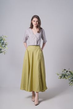 "Linen Maxi Skirt BUTTONS, Flattering Summer Skirt, Linen Long Skirt, Green Linen Skirt, Split Linen Skirt, Maxi Linen Skirt, Long Skirt This skirt is perfect to be a summer dress and is also great to wear to work! Feature with a split on the side and decorative buttons, it is so unique and gives you such a vintage look! To Rush your order, add lining (recommend for White/Aqua/Light Turquoise/Light Caramel dress), please upgrade your order here: https://www.etsy.com/uk/listing/1334897850/upgrade Green Tiered Skirt With Pockets, Spring Asymmetrical Skirt With Buttons, Spring Asymmetrical Buttoned Skirt, Asymmetrical Button Skirt For Spring, Fitted Long Skirt With Buttons, Green Long Wrap Skirt, Green Relaxed Wrap Skirt, Asymmetrical Skirt With Pockets In Relaxed Fit, Green Pleated Wrap Skirt