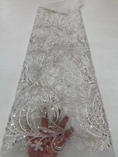 This high quality Fabric is measured in 5 Yards With Embroidered Beading and Sequin. It is soft, very delicate and beautiful. This high Quality Fabric is made with Fashion embroidered rhinestones can be used in making party wedding dresses, skirts, shawls, scarves and other other fashion apparels as you would like. Size : Length : 5 yards (180 inch). Width: 50 inch (Please allow slight deviation for the measurement data ,±1 inch) Material: 100% Polyester, Tulle Lace Fabric, Eco-Friendly embroide Yard Wedding, Beaded Lace Fabric, Nigerian Lace, Luxury Fabric, Wedding Lace, African Lace, Sequins Embroidery, Sequin Beading, Tassel Fringe