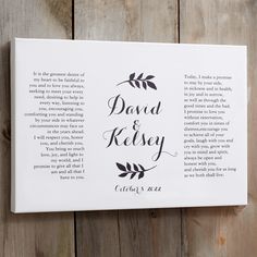 a canvas mounted to the side of a wooden wall that says, david and kisey