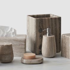 marble bathroom accessories including soap dispenser, soap dish and toothbrush holder