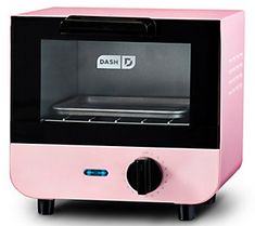 a pink toaster oven sitting on top of a white table