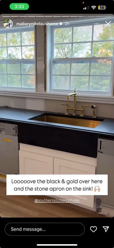 a kitchen with black and gold counter tops on the appliance, next to a window