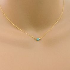 Turquoise Bead Coker Necklace Composed of a 3mm turquoise howlite bead with 2mm metal gold filled or sterling silver beads on each side. Dainty 14k gold filled or sterling silver cable chain with spring ring closure. Looks great with anything you pair it with! CUSTOM REQUESTS ARE ALWAYS WELCOMED! ● Would you prefer a different size/color stone or pearl? I can make these with most any stone you see in my shop. I can also special order stones or pearls for you upon request. ● Prefer a shorter or l Gold Minimalist Charm Necklaces With Natural Stones, Minimalist Gold Charm Necklaces With Natural Stones, Minimalist Gold Charm Necklace With Natural Stones, Adjustable Gold Turquoise Necklace With Gemstone, Adjustable Gold Turquoise Gemstone Necklace, Adjustable Turquoise Birthstone Necklace, Dainty Gold Turquoise Necklace As Gift, Gold Turquoise Gemstone Necklace In Dainty Style, Dainty Gold Turquoise Gemstone Necklace