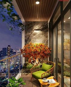 a balcony with a green chair and potted plant on the floor next to it