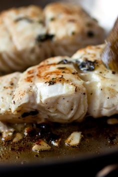 some kind of food that is being cooked in a pan